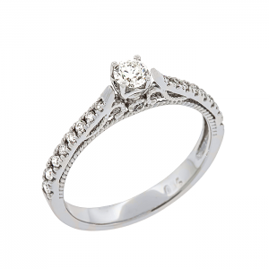 Λευκόχρυσο μονόπετρο δαχτυλίδι τετράδοντο με διαμάντι 0.16ct σε 18 καράτια. RD19962